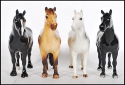 A collection of four Beswick ceramic figurines modelled as horses / ponies to include a Grey