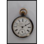 A early 20th century white metal open face pocket watch, having white enamel face with roman