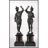 A matching pair late 19th / early 20th Century Spanish spelter figures in the form of two bannermen,