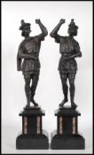 A matching pair late 19th / early 20th Century Spanish spelter figures in the form of two bannermen,