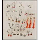 A large collection of stamped 835 silver drop earrings set with a variety of coloured stones, and