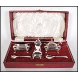 A vintage 20th Century Walker and Hall silver plated condiment cruet set complete in original box