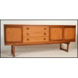A retro mid 20th Century teak wood sideboard credenza, two cupboards to right of bank of three