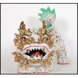 A large 20th Century ceramic Chinese Temple Fu dog figure having applied green raised decoration