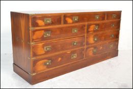 A Regency revival 20th century yew wood campaign ' Captains ' double chest of drawers. The wide body