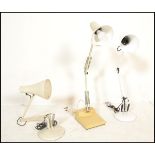 A group of three vintage 20th Century angle poise desk top lamps, all having a white enamelled
