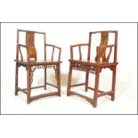 A pair of near matching believe 19th / 20th century Chinese armchairs / elbow chairs having solid