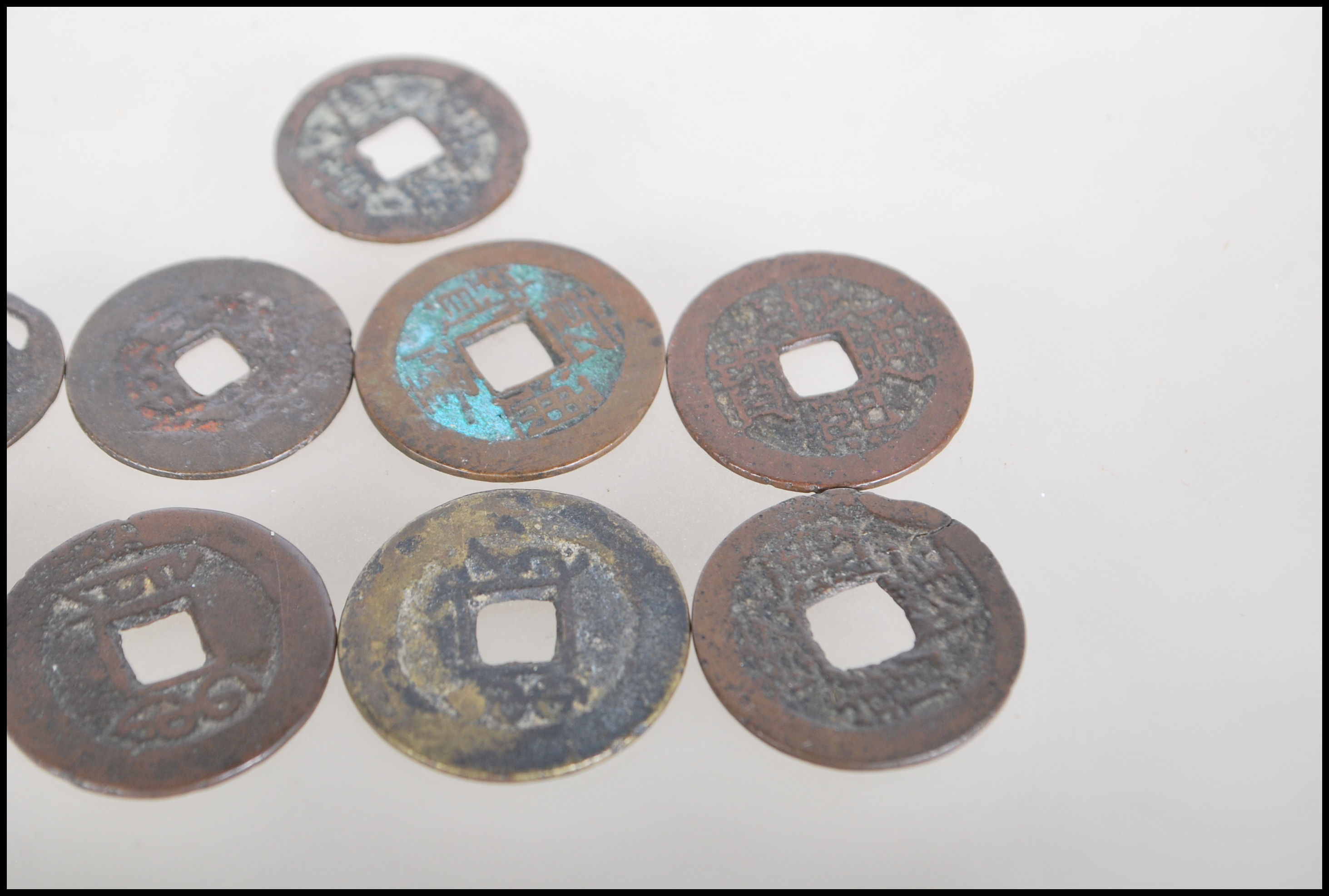 A group of nine Chinese tang dynasty coins having square pierced centres. Nine in total. - Image 7 of 7