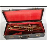 A vintage 20th Century cased Boosey & Hawkes Regent Trumpet, with mouthpiece & accessories within