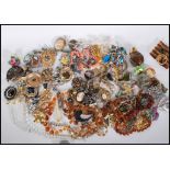 A collection of vintage costume jewelry to include bracelets, rings, earrings, brooches,