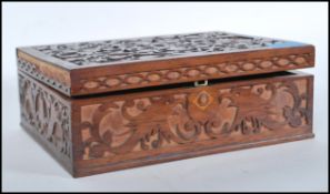 A 19th Century Victorian fretwork work box having a variety of vintage curios to the inner to