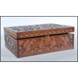 A 19th Century Victorian fretwork work box having a variety of vintage curios to the inner to