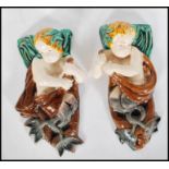 A pair of 19th Century Victorian figural majolica wall pockets in the manor of Mintons being of a