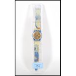 A collectors wrist watch by Swatch quartz water resistant having gilt face with Chinese character