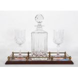 A 20th Century cut glass crystal decanter and glass tantalus set, the set to include decanter with