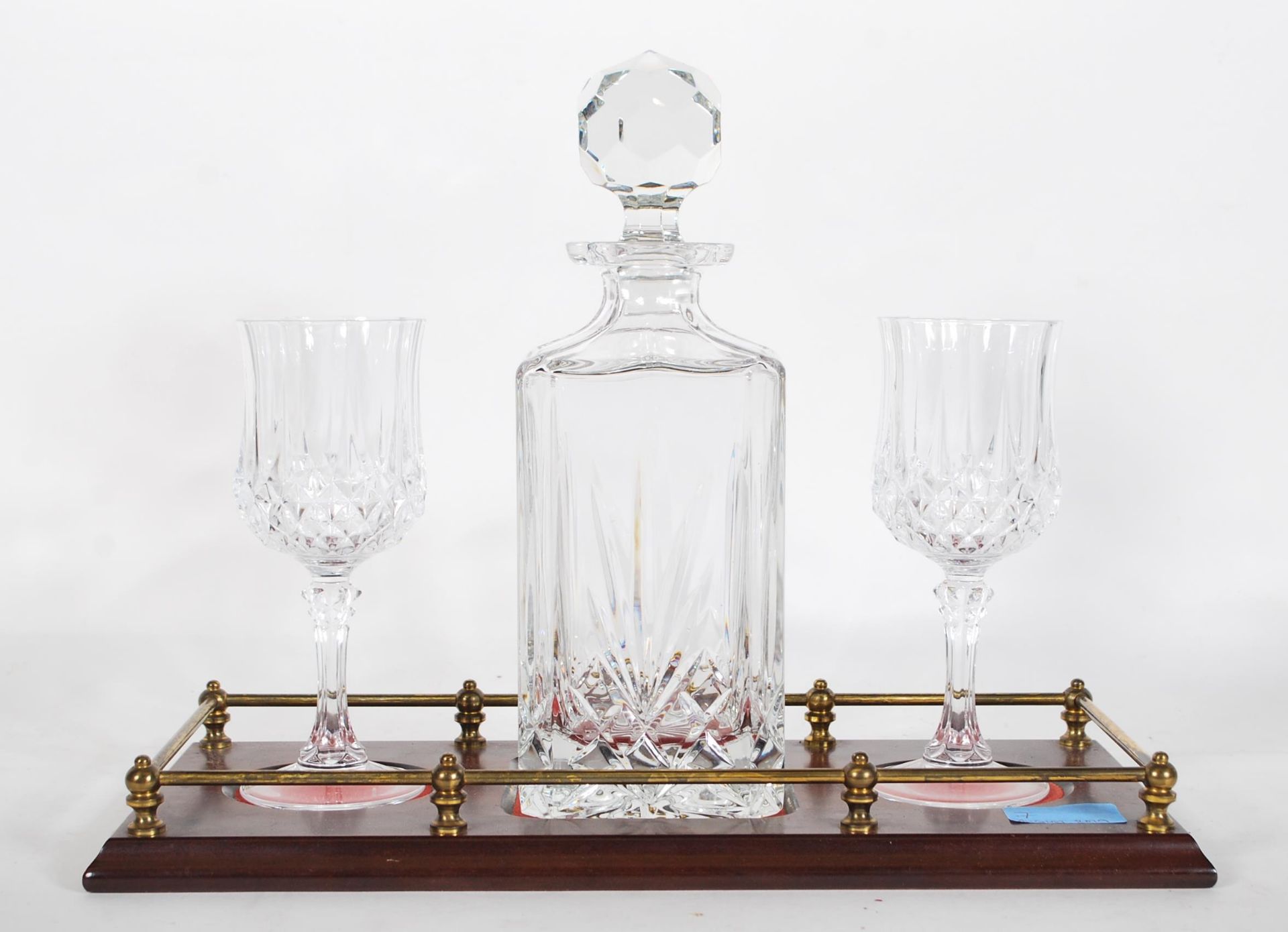 A 20th Century cut glass crystal decanter and glass tantalus set, the set to include decanter with