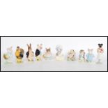 A collection of eleven Beswick ceramic Beatrice Potter figurines to include Mr Benjamin Bunny, Tom