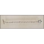 A silver 925 belcher hoop link bracelet chain with t-bar and star shaped clasp hoop. Total length