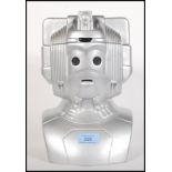 A novelty ceramic biscuit tin in the form of a Doctor Who Cyberman having a silvered finish, the top