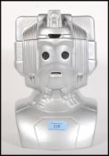 A novelty ceramic biscuit tin in the form of a Doctor Who Cyberman having a silvered finish, the top