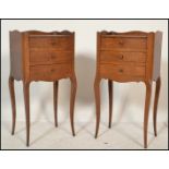 A pair of early 20th century French oak bedside tables / cabinets. Each raised on sabre legs with