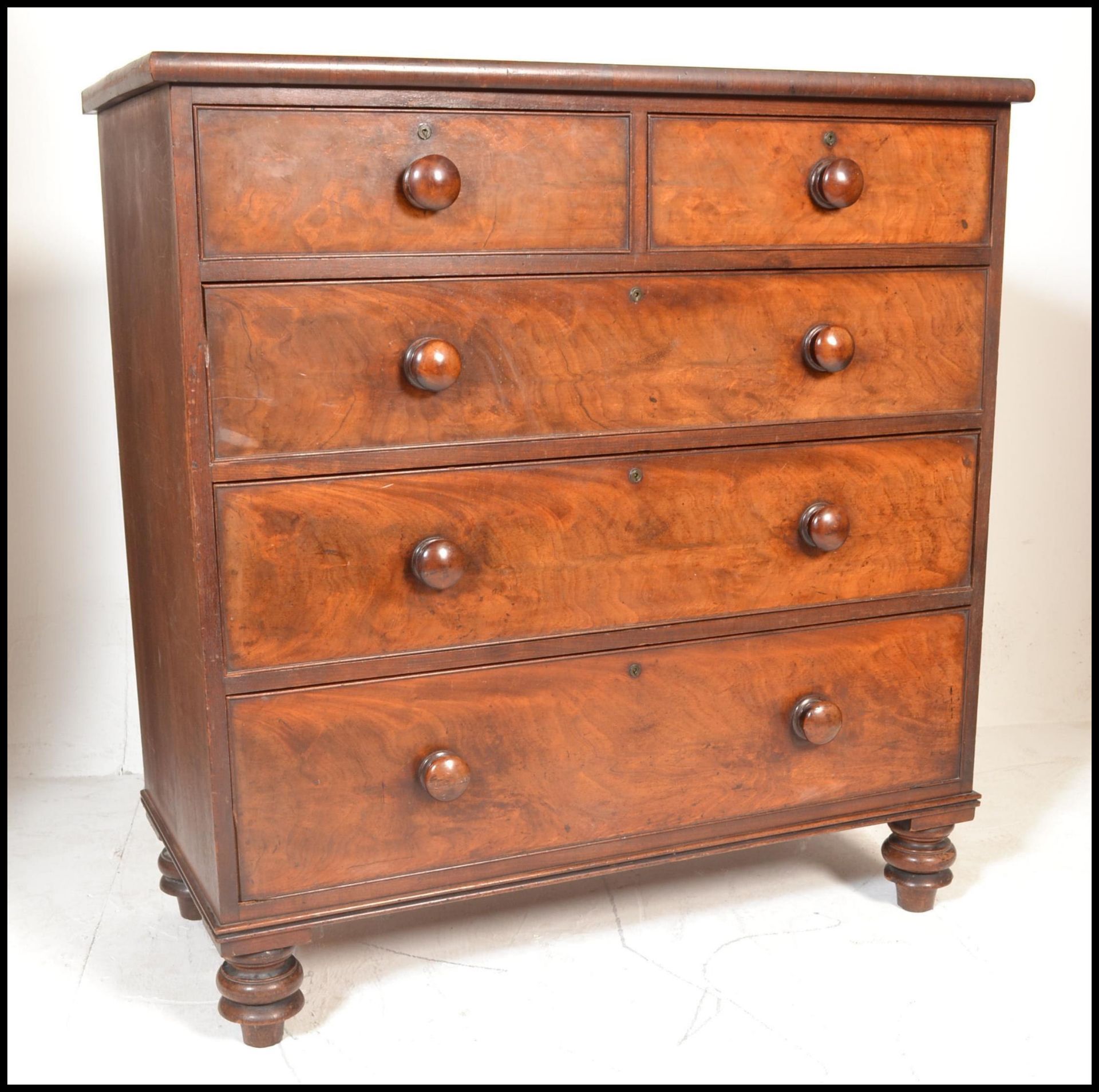 A 19th Century Victorian mahogany chest of drawers, flared top above two short drawers over three