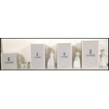 A collection of four Lladro ceramic figurines to include A Proper Pose 6124, Sweet and Shy 6754,