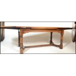 An excellent solid oak monastic refectory dining table in the Jacobean manner of long, large form.