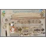 A collection of vintage jewellery to include, a Victorian sweetheart brooch decorated with gold