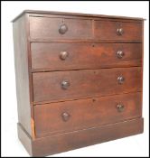 A Victorian 19th century oak chest of drawers. Raised on a plinth base with 2 short drawers having 3