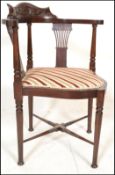 An Edwardian mahogany framed corner chair / armchair with recently re-upholstered seat pad seat
