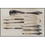 A collection of silver hallmarked handled implements to include 2 files, 3 picks, a pair of
