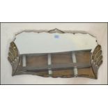 A vintage Art Deco 1920's frameless bevelled glass mirror having a symmetrical fanned design to