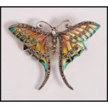 A stamped 925 silver plique a jour brooch in the form of a butterfly set with marcasites. Weight
