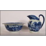 A 19th Century Victorian ironstone wash jug and bowl transfer printed in blue and white with a