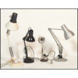 A group of three retro 20th century anglepoise desk lamps of different styles to include one in a