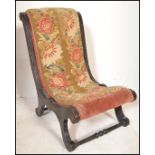 A 19th Century ebonised parcel gilt frame nursing slipper chair, button back upholstered seat pad