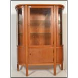 A vintage  early 20th century French Art Deco style bow fronted glazed vitrine display cabinet /