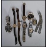 A collection of eight mens wrist watches together with a selection of ladies cocktail watches to