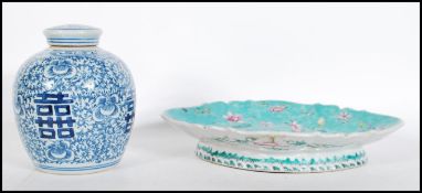 A late 19th Century Chinese dish / tazza having scalloped edge with turquoise ground and enamel