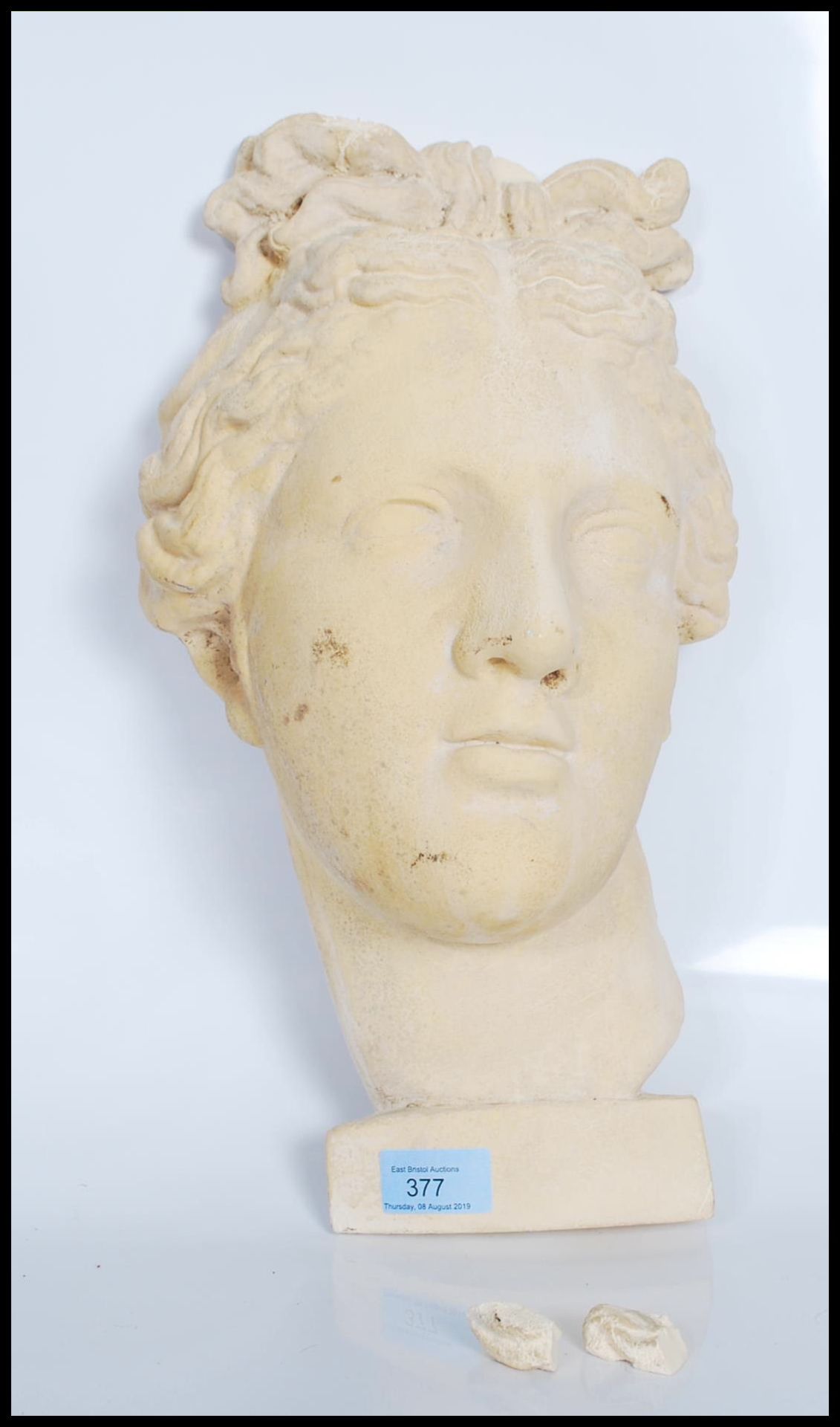A contemporary 20th Century head wall hanging sculpture of Venus De Milo made from plaster. Measures