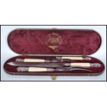 A Joseph Rodgers & Sons carving set having carved candy twist handles to include two carving