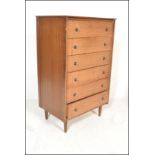 A mid century teak wood Danish influence pedestal chest of drawers. Raised on angular legs, the