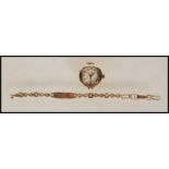 A 9ct gold London hallmarked ladies dress watch. Inset 15 Jewel movement being Swiss made.
