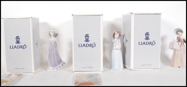A collection of three Lladro ceramic figurines to include New Shoes 6487, Gone Shopping 6488 and