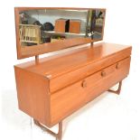 A vintage mid 20th Century teak wood dressing table sideboard having three cupboard with circular