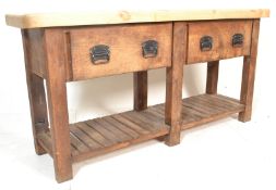 A large antique style heavy country pine double scullery butchers block style kitchen table.