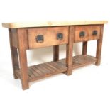 A large antique style heavy country pine double scullery butchers block style kitchen table.