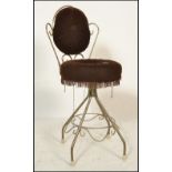 A retro vintage 20th century bedroom boudoir wire work dressing table chair having a scroll work
