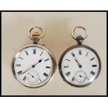 Two silver hallmarked open face pocket watches, both having white enamel face with Roman numeral
